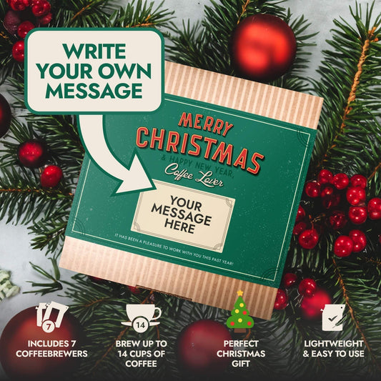 festive Christmas coffee gift box with customizable message surrounded by holiday decorations and pine branches